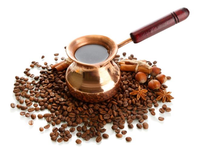 Coffee pot and coffee beans, isolated on white